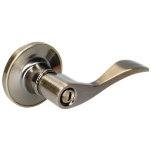 Manija tubular curva función baño, latón antiguo, llave estándar, blíster. Lock
